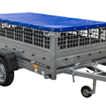 Einachsiger Anhänger auf Blattfedern 264×125 UNITRAILER GARDEN 264/R KIPP mit Gitterseitenwänden, H-0-Rahmen und blauer Plane-Neu